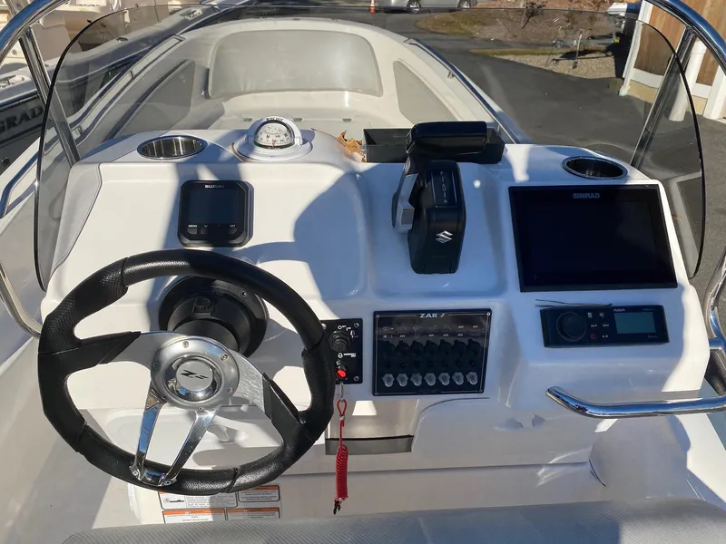 Slide: The Image of 2023 Zar Formenti Zar 65 boat interior with red and brown seating. - 5