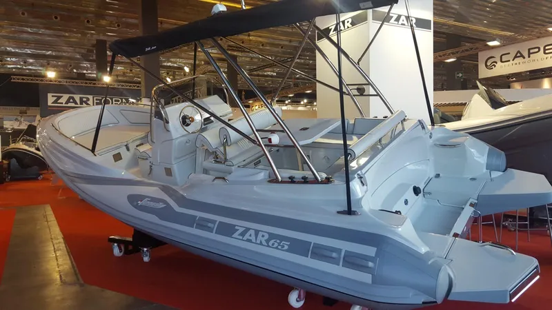 Slide: The Image of 2023 Zar Formenti Zar 65 boat interior with seating and table, docked outdoors. - 6