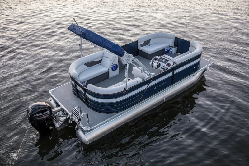 Slide: The Image of 2023 Crest Classic LX pontoon boat on water. - 4