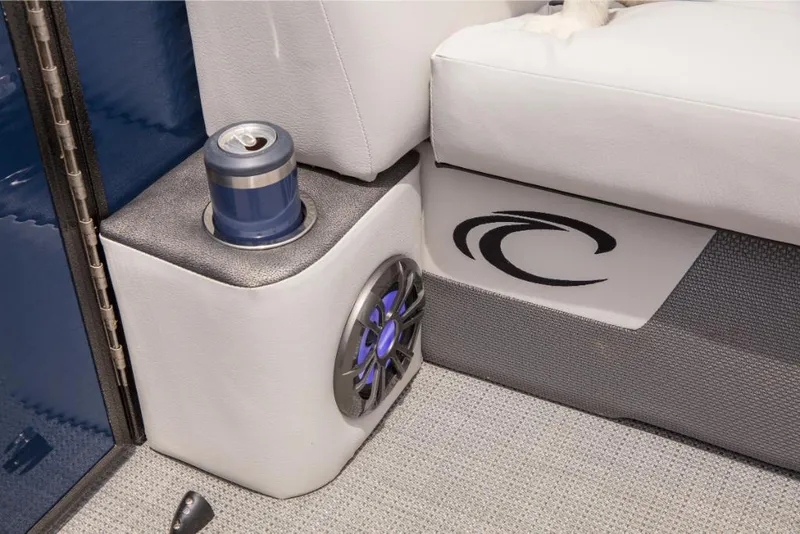 Slide: The Image of 2023 Crest Classic LX boat interior with cup holder and speaker. - 7
