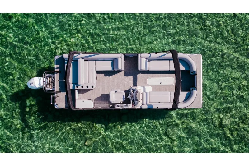 Slide: The Image of 2023 Crest Classic DLX pontoon boat on clear green water. - 3