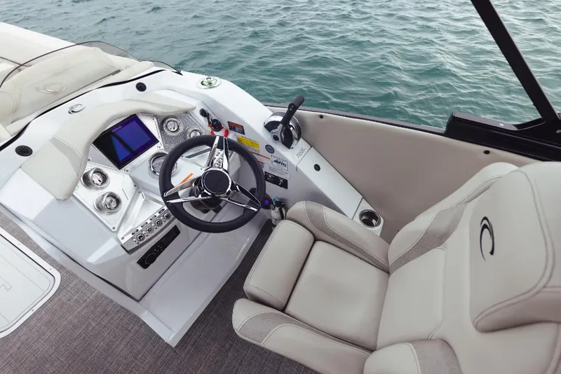 Slide: The Image of 2023 Crest Caribbean Platinum boat helm with steering wheel and control panel. - 5
