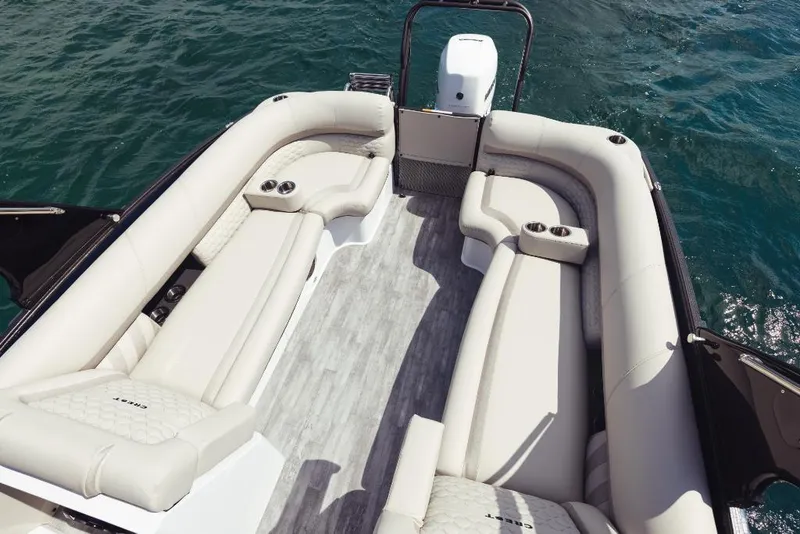 Slide: The Image of 2023 Crest Savannah 270 boat interior with luxurious seating on water. - 9