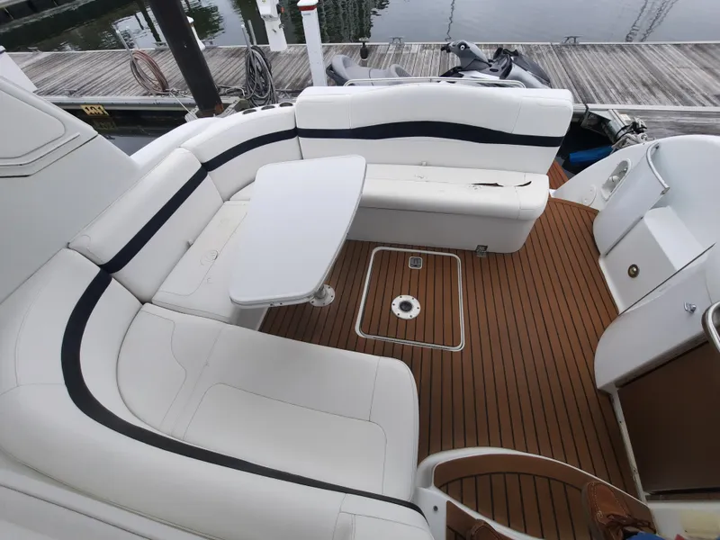 Slide: The Image of 2008 Formula 40 PC boat with white seating and wooden deck. - 11