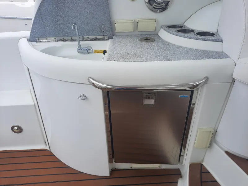 Slide: The Image of 2008 Formula 40 PC boat kitchenette with sink, countertop, and mini fridge. - 13