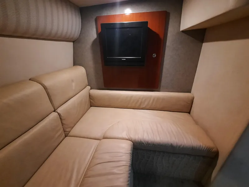 Slide: The Image of 2008 Formula 40 PC interior with beige leather seating and wall-mounted TV. - 14