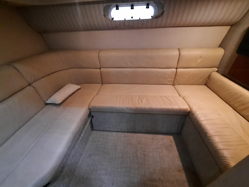 Slide: The Image of Interior seating area of a 2008 Formula 40 PC yacht with beige upholstery. - 16