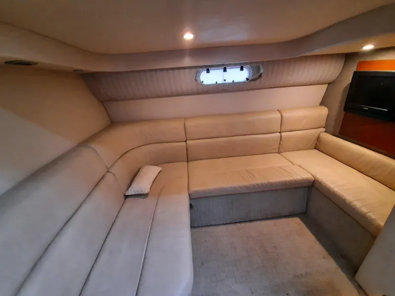 Slide: The Image of Interior of 2008 Formula 40 PC yacht with beige leather seating and small window. - 17