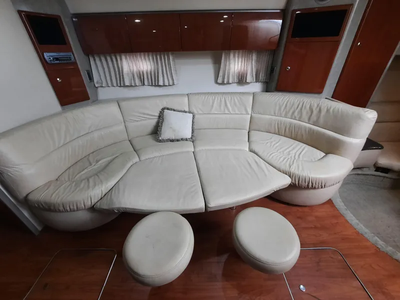 Slide: The Image of 2008 Formula 40 PC yacht interior with curved leather sofa and ottomans. - 18