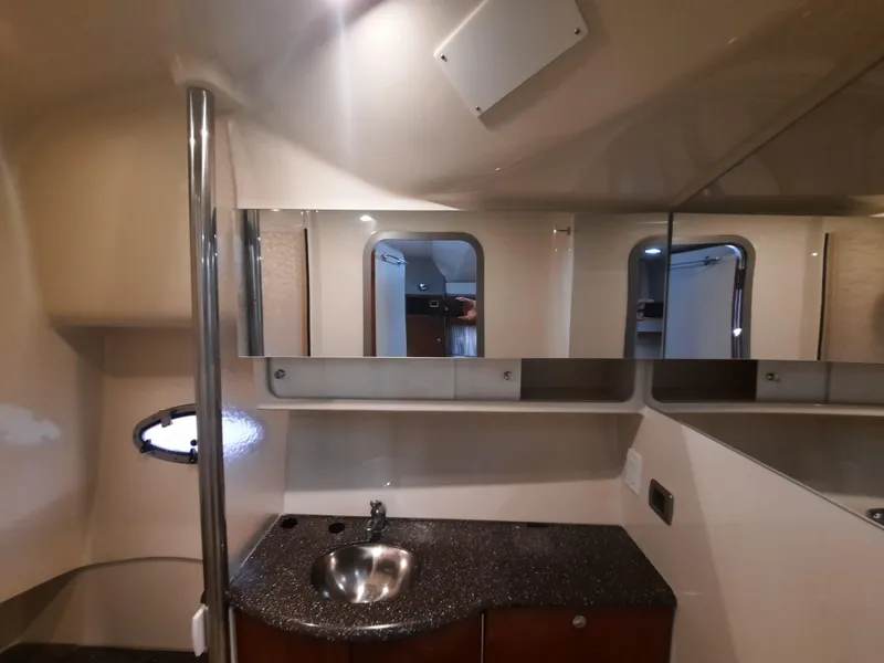 Slide: The Image of 2008 Formula 40 PC yacht bathroom with sink, mirror, and porthole window. - 28