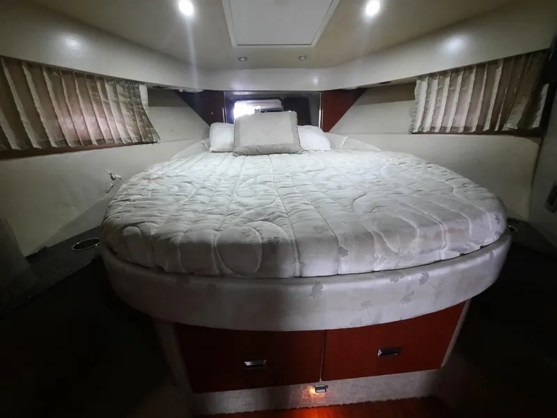 Slide: The Image of 2008 Formula 40 PC boat interior cabin with bed and storage. - 30