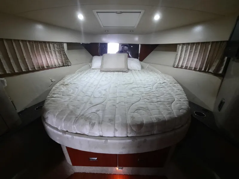 Slide: The Image of Luxurious 2008 Formula 40 PC yacht cabin with a spacious bed and ambient lighting. - 34