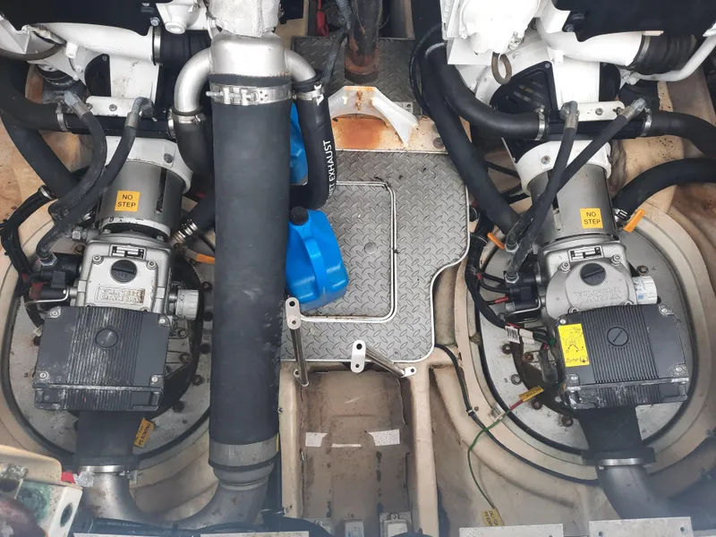 Slide: The Image of Engine compartment of a 2008 Formula 40 PC boat with twin engines and various components. - 37