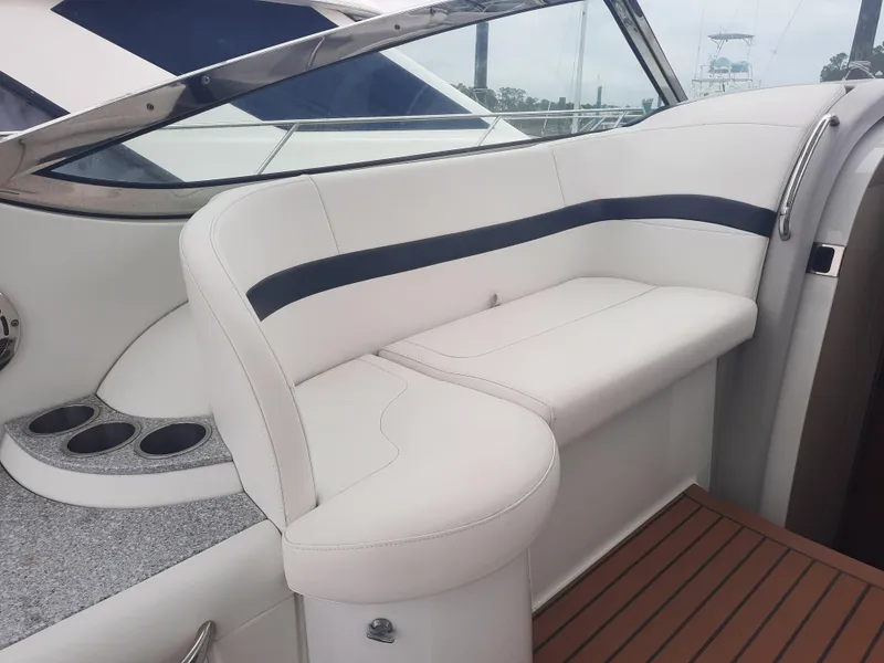 Slide: The Image of 2008 Formula 40 PC boat interior with white leather seating and cup holders. - 9