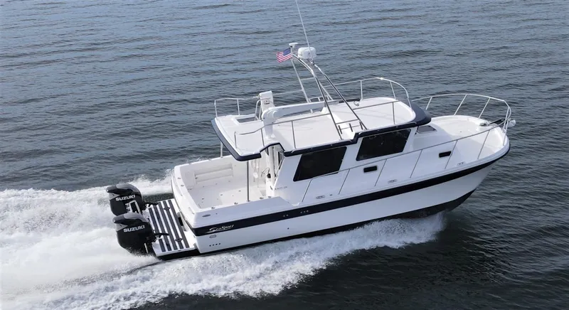 The Image of 2026 SeaSport 3200 Pacific boat cruising on open water with dual engines. - 0