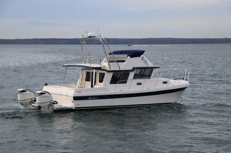 Slide: The Image of 2026 SeaSport 3200 Pacific boat cruising on open water. - 5