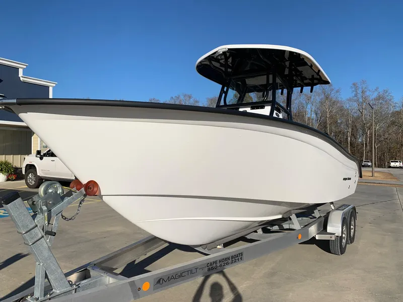 Slide: The Image of 2024 Cape Horn 24 XS boat on a trailer in a parking lot. - 1