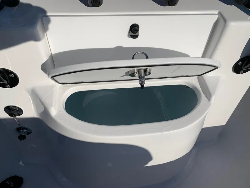 Slide: The Image of 2024 Cape Horn 24 XS boat livewell with open lid. - 6