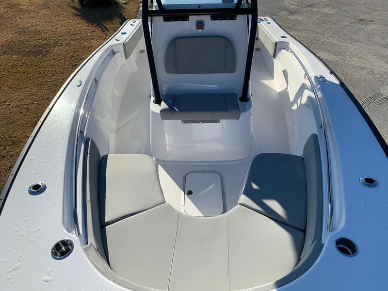 Slide: The Image of 2024 Cape Horn 24 XS boat interior with cushioned seating. - 17