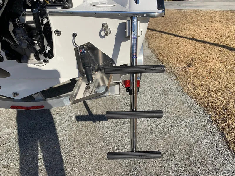 Slide: The Image of 2024 Cape Horn 24 XS boat with extended swim ladder and trim tabs. - 4