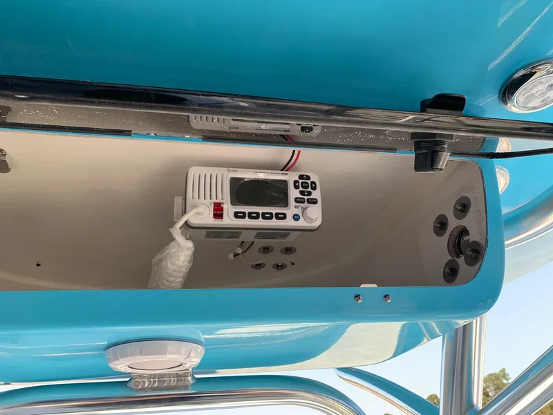 Slide: The Image of 2026 Key West 239 FS boat console with radio and controls, blue interior. - 4