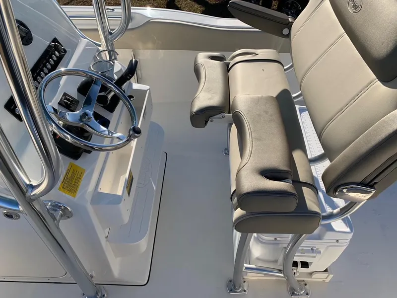 Slide: The Image of 2026 Key West 239 FS boat interior with steering wheel and seating. - 7