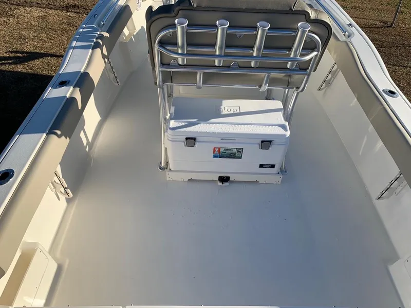 Slide: The Image of 2026 Key West 239 FS boat interior with cooler and rod holders. - 9