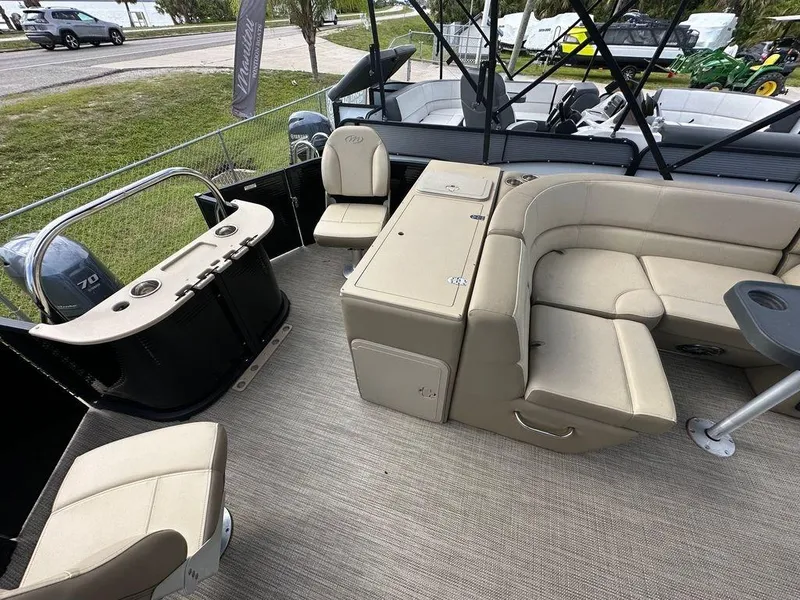 Slide: The Image of 2022 Manitou 20 Aurora LE Angler Full Front Twin Tube interior with beige seating. - 14
