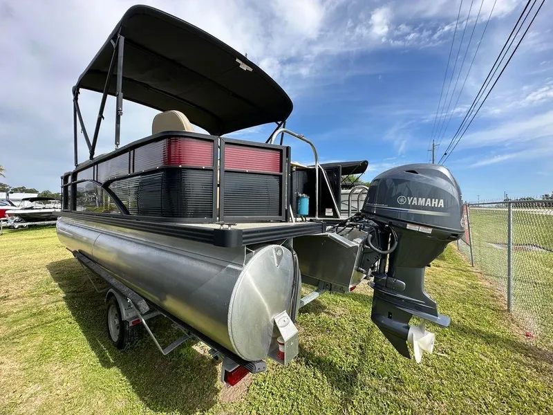 Slide: The Image of 2022 Manitou 20 Aurora LE Angler Full Front Twin Tube pontoon boat with Yamaha outboard motor. - 5