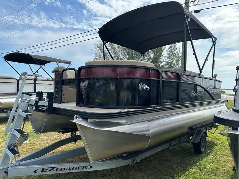 Slide: The Image of 2022 Manitou 20 Aurora LE Angler Full Front Twin Tube pontoon boat on EZ Loader trailer. - 7