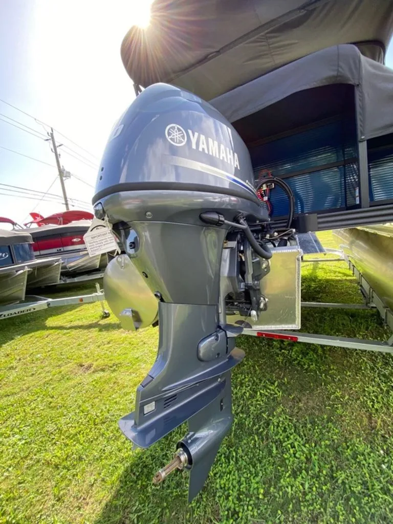 Slide: The Image of 2022 Manitou 18 Aurora LE Twin Tube 25 with Yamaha outboard motor. - 10
