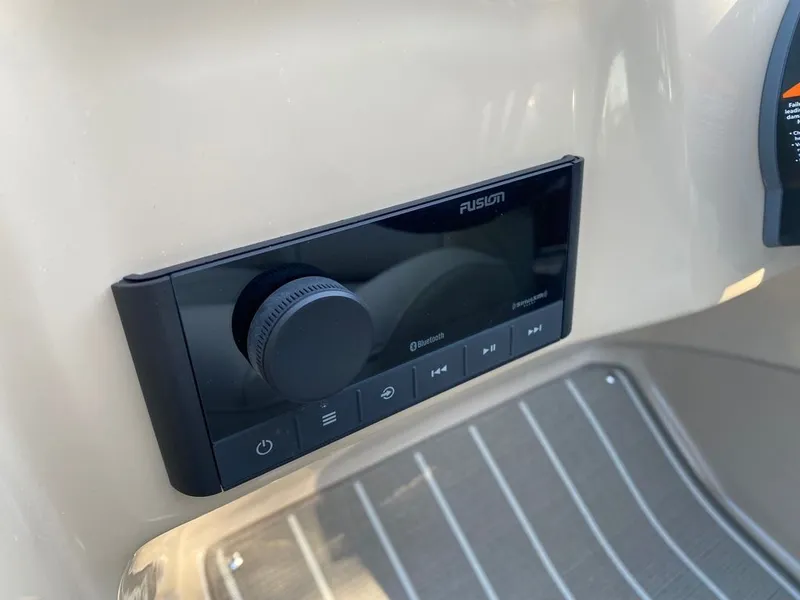 Slide: The Image of 2022 Manitou 23 Oasis SR VP boat stereo system with Bluetooth connectivity. - 22