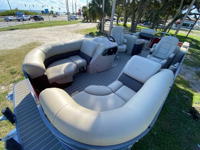 Slide: The Image of 2022 Manitou 23 Oasis SR VP pontoon boat with spacious seating and modern design. - 9
