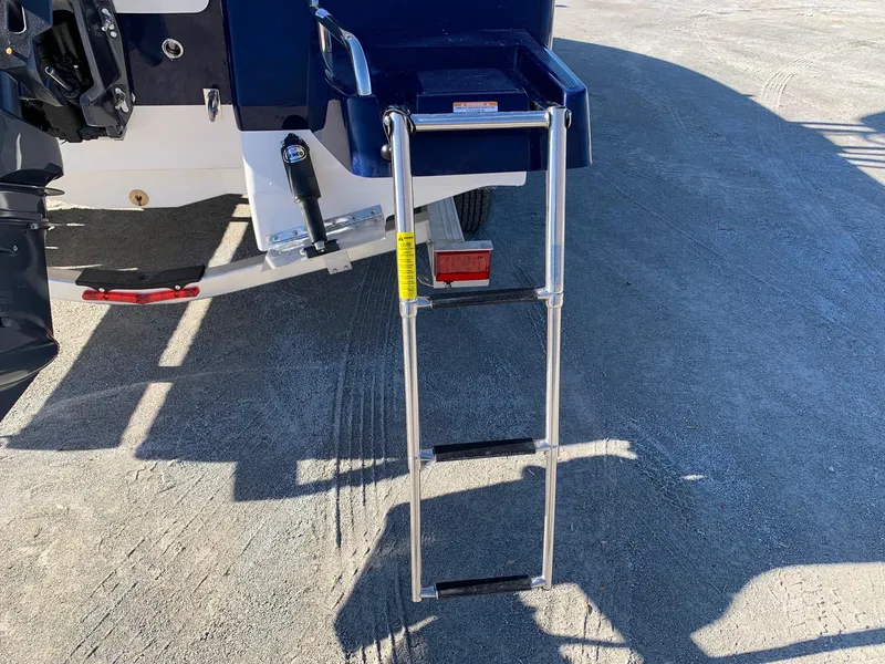 Slide: The Image of 2024 Robalo 226 Cayman boat with extended swim ladder. - 11