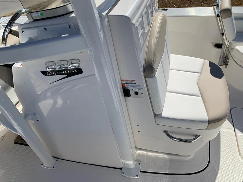 Slide: The Image of 2024 Robalo 226 Cayman boat interior with seating and console. - 16