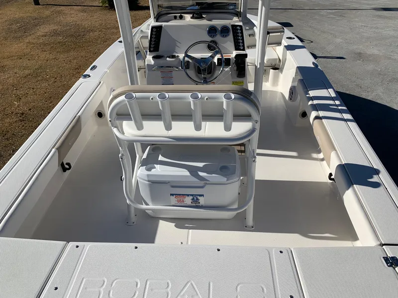 Slide: The Image of 2024 Robalo 226 Cayman boat interior with steering console and seating. - 12