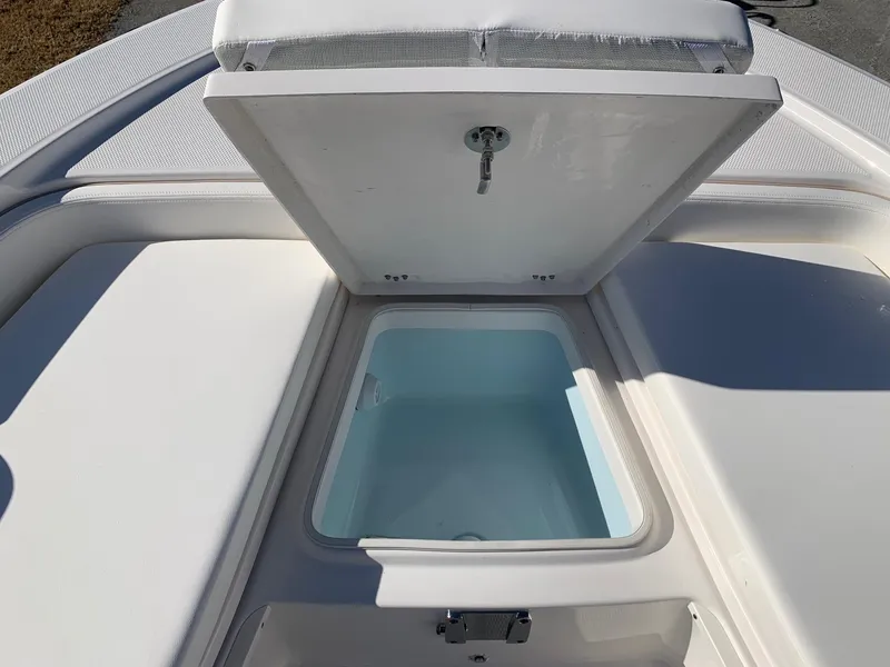 Slide: The Image of Open storage compartment on 2024 Robalo 226 Cayman boat. - 15