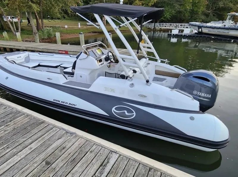 The Image of 2025 Walker Bay WB 22 boat docked, featuring Yamaha outboard motor. - 0