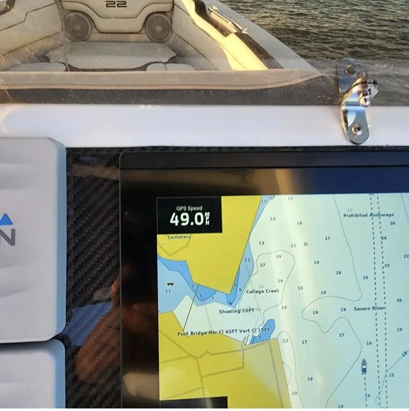 Slide: The Image of Walker Bay WB 22 boat dashboard with GPS showing 49.0 mph speed. - 6