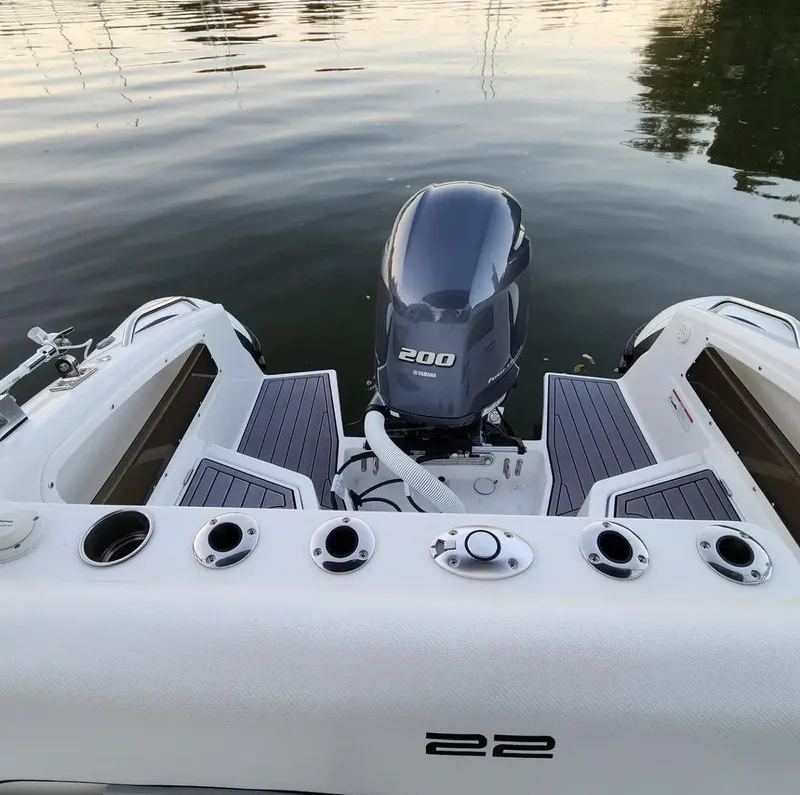 Slide: The Image of Walker Bay WB 22 (2025) boat with Yamaha 200 outboard motor on calm water. - 7