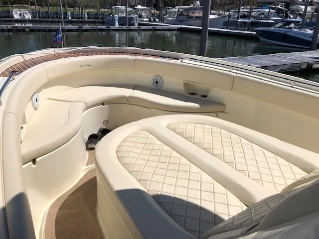 Slide: The Image of 2021 Chris-Craft Catalina 30 boat with luxurious seating at a marina. - 9