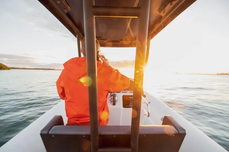 Slide: The Image of 2024 Northstar Orion 8 boat with passengers enjoying a sunny day on the water. - 15