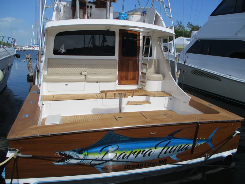 Slide: The Image of 2008 Custom Carolina 53 Sculley fishing boat docked, rear view. - 11