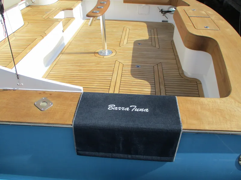 Slide: The Image of 2008 Custom Carolina 53 Sculley boat deck with teak flooring and Barra Tuna mat. - 22