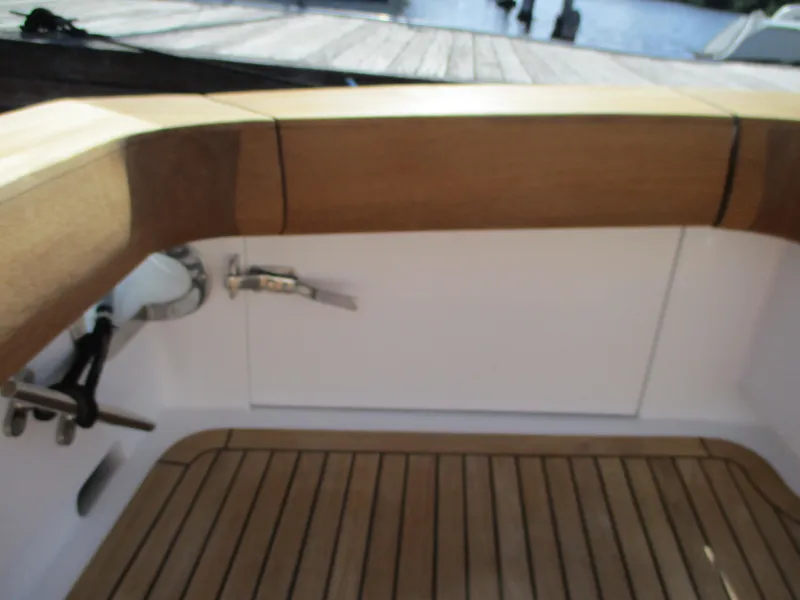Slide: The Image of Cockpit of 2008 Custom Carolina 53 Sculley with teak flooring and wooden trim. - 23