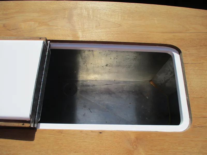 Slide: The Image of Open storage compartment on 2008 Custom Carolina 53 Sculley boat. - 26
