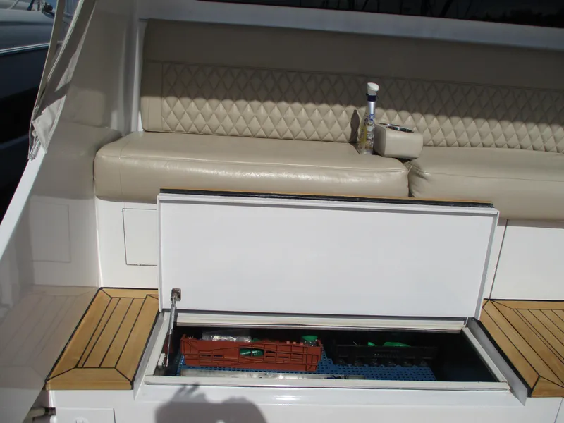 Slide: The Image of 2008 Custom Carolina 53 Sculley boat with open storage compartment and cushioned seating. - 30