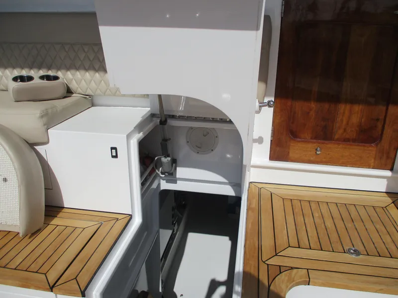 Slide: The Image of 2008 Custom Carolina 53 Sculley boat interior with open hatch and wooden accents. - 34