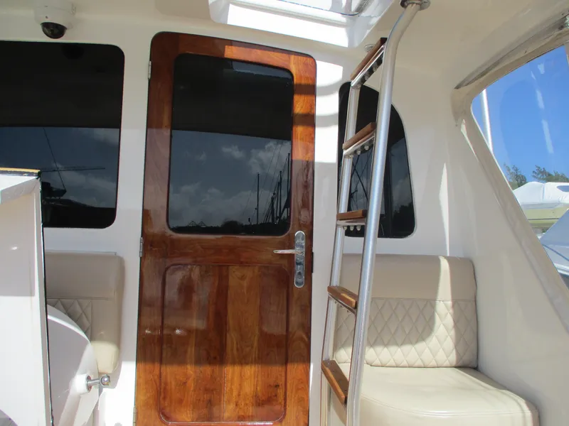 Slide: The Image of Interior of 2008 Custom Carolina 53 Sculley with wooden door and ladder. - 37