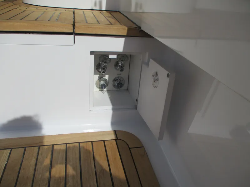 Slide: The Image of 2008 Custom Carolina 53 Sculley boat deck with open hatch and wooden flooring. - 39